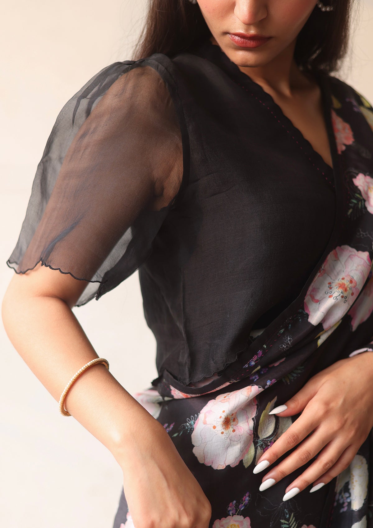Black designer blouse, crafted in handwoven organza silk, from Surmaye. Scalloped embroidery edges all over. Lined with handwoven mulberry silk.