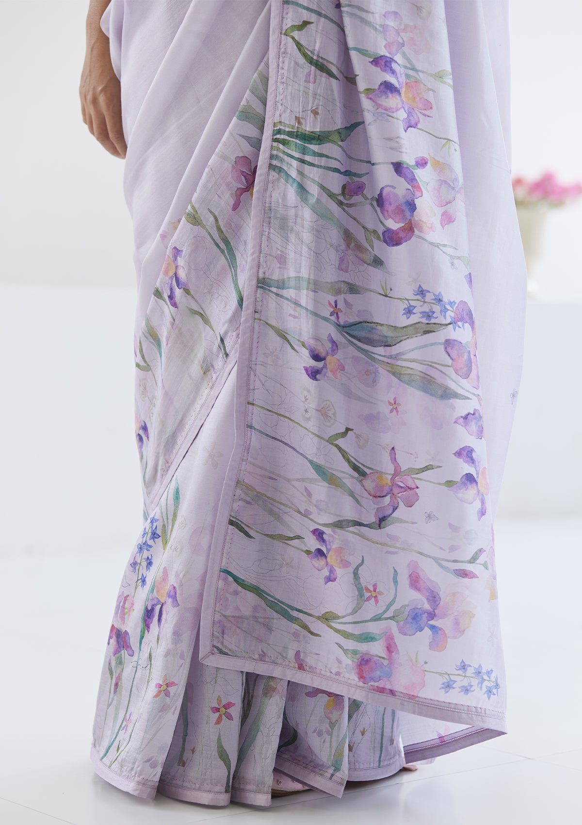 Handloom organza mulberry silk saree in mauve, from Surmaye. Intricate, hand-drawn, iris flower border print.