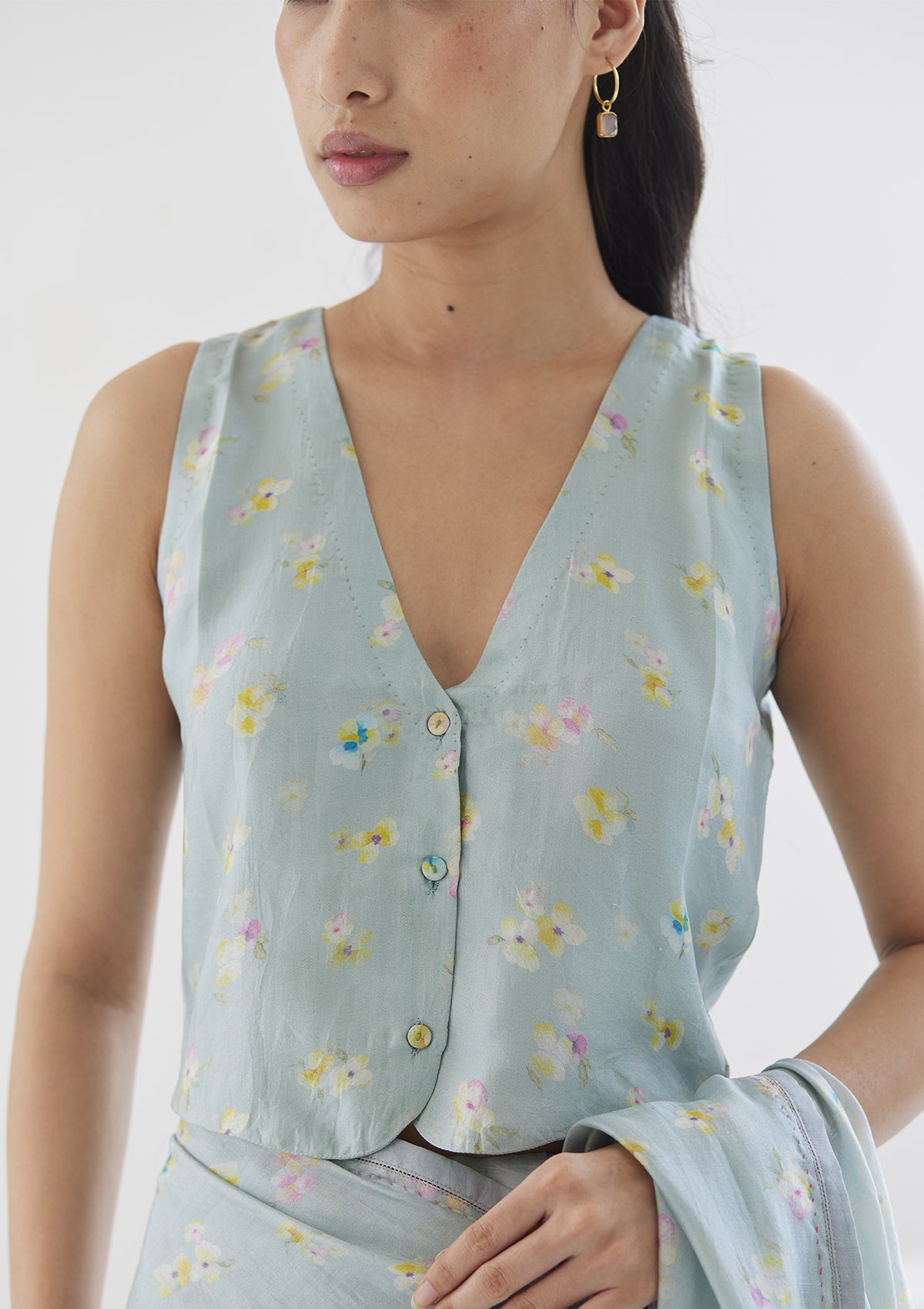 Handwoven designer blouse in seafoam colour, from Surmaye. Floral pansy print.