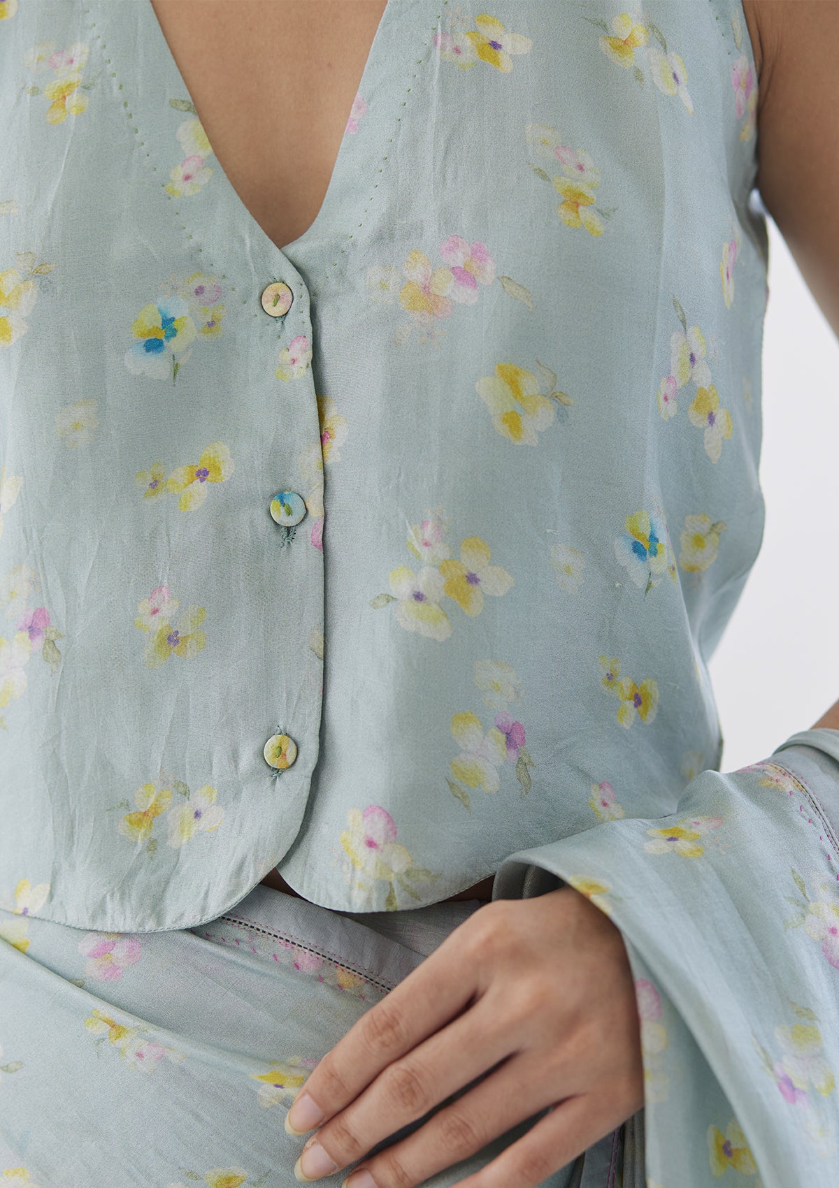 Handwoven designer blouse in seafoam colour, from Surmaye. Floral pansy print.