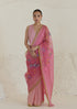 Handloom organza mulberry silk jamdani saree in carnation pink, from Surmaye. Intricate all-over floral motifs. Paired with designer blouse with pink gingham checks.