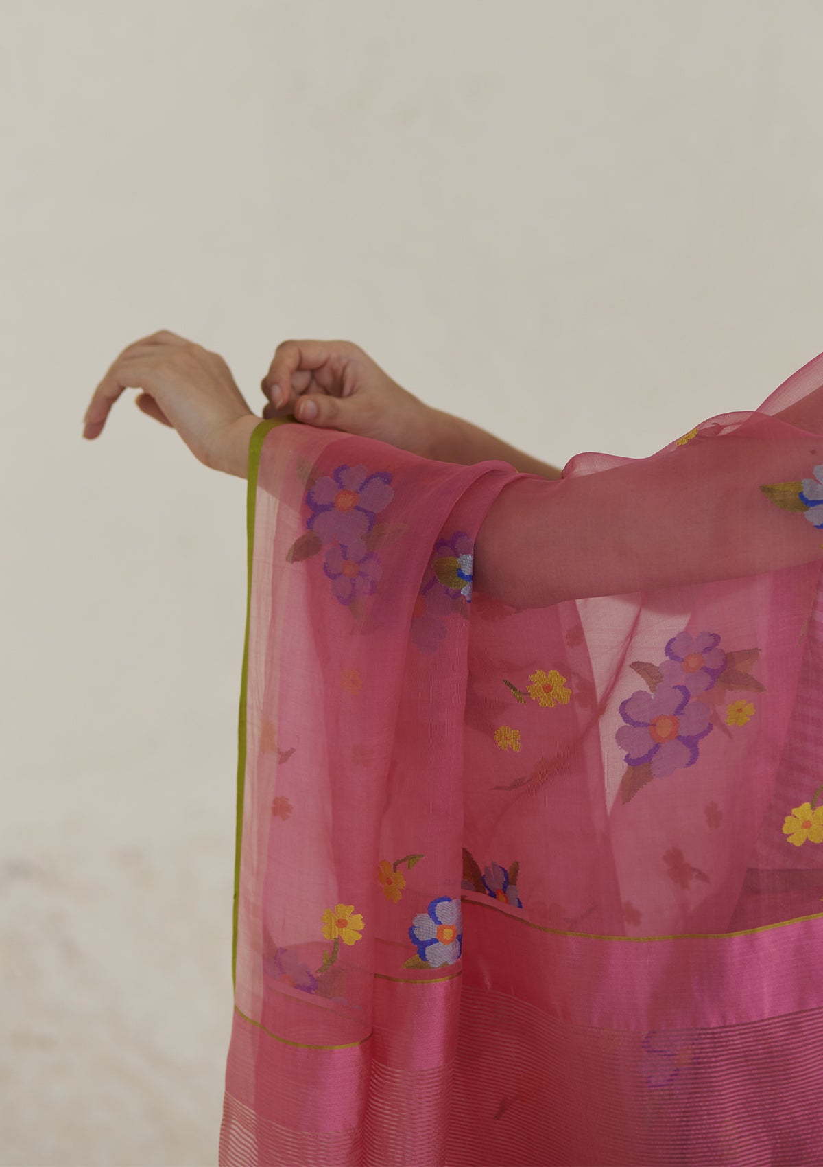 Handloom organza mulberry silk jamdani saree in carnation pink, from Surmaye. Intricate all-over floral motifs. Close-up of floral motifs.