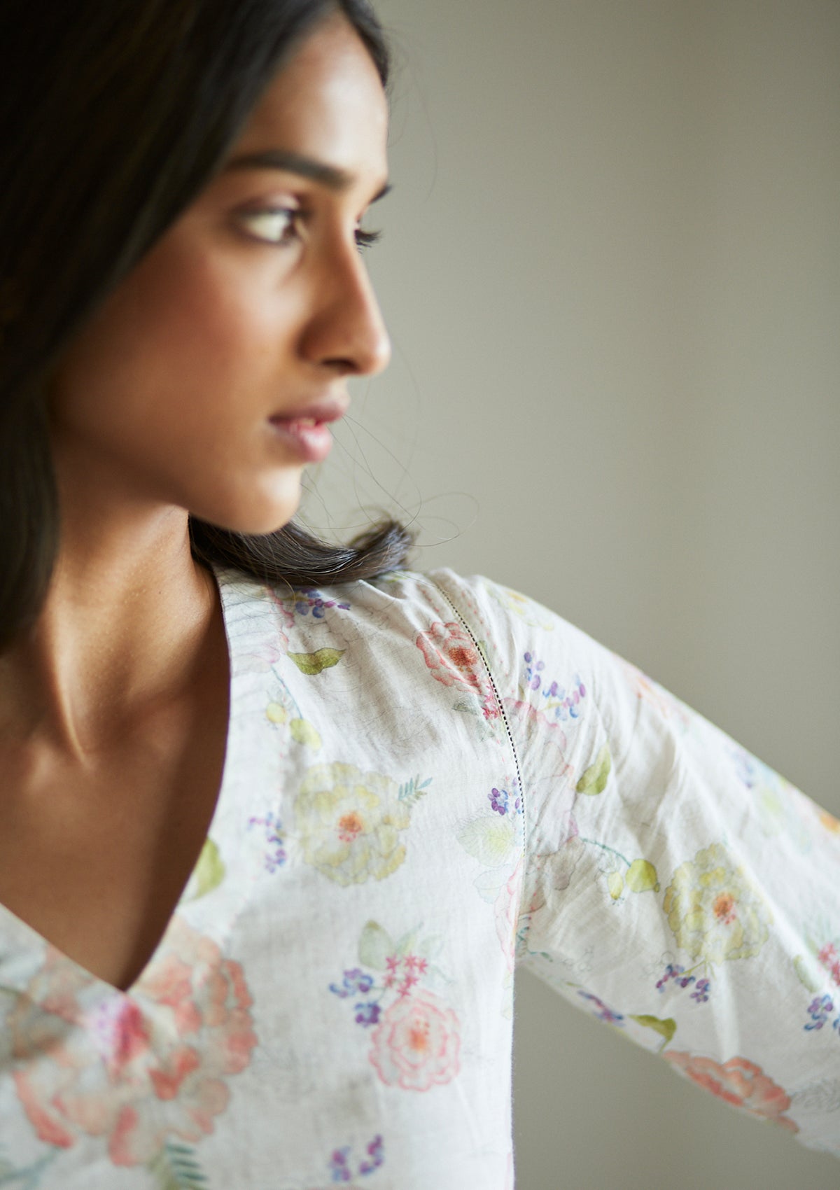 Ivory Kurta Set for women, from Surmaye. Made in handwoven khadi with a hand-drawn floral print, and a decorative running stitch accent.