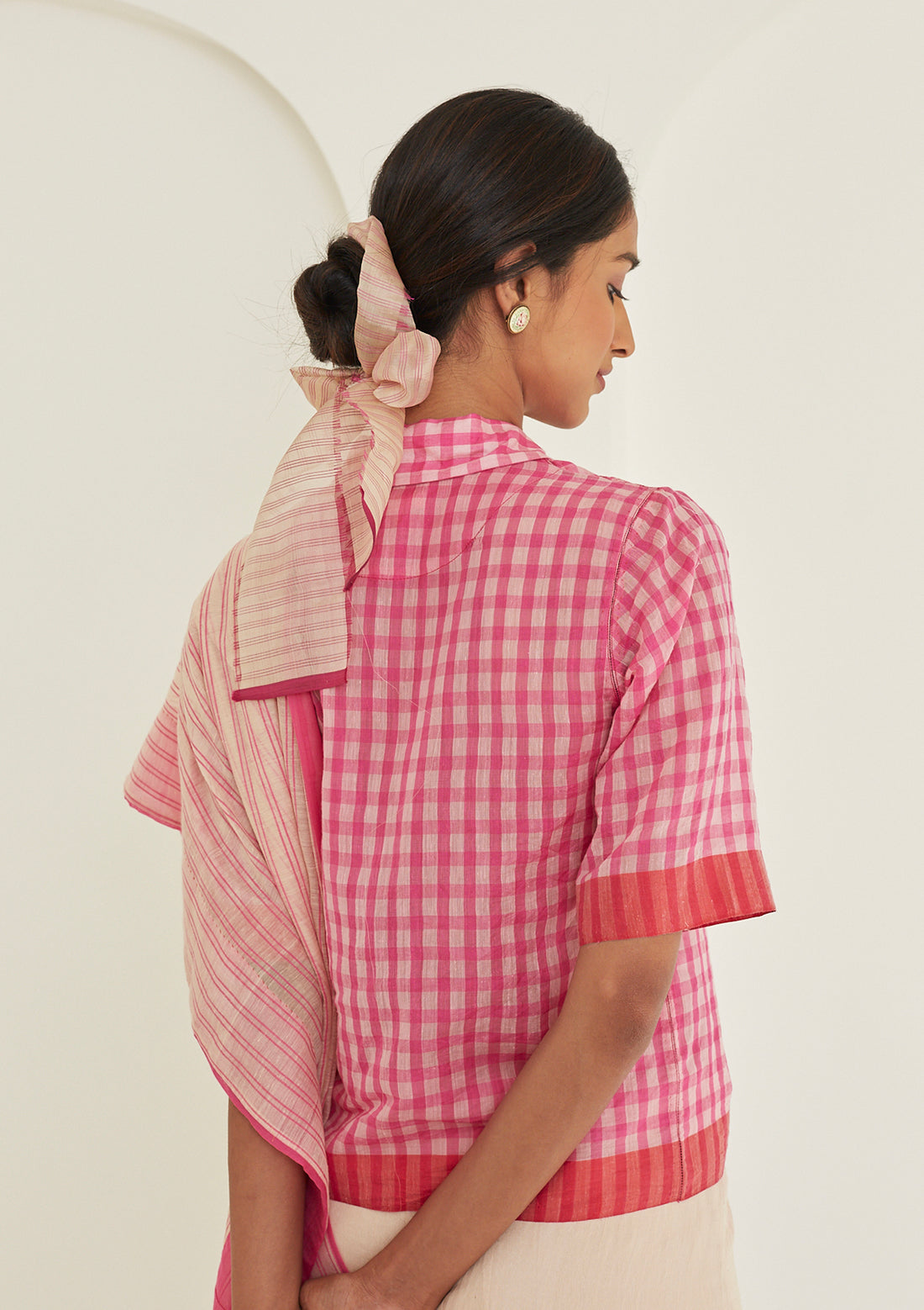 Pink designer blouse in softest handwoven silk khadi, from Surmaye. Gingham checks pattern in a shirt silhouette.