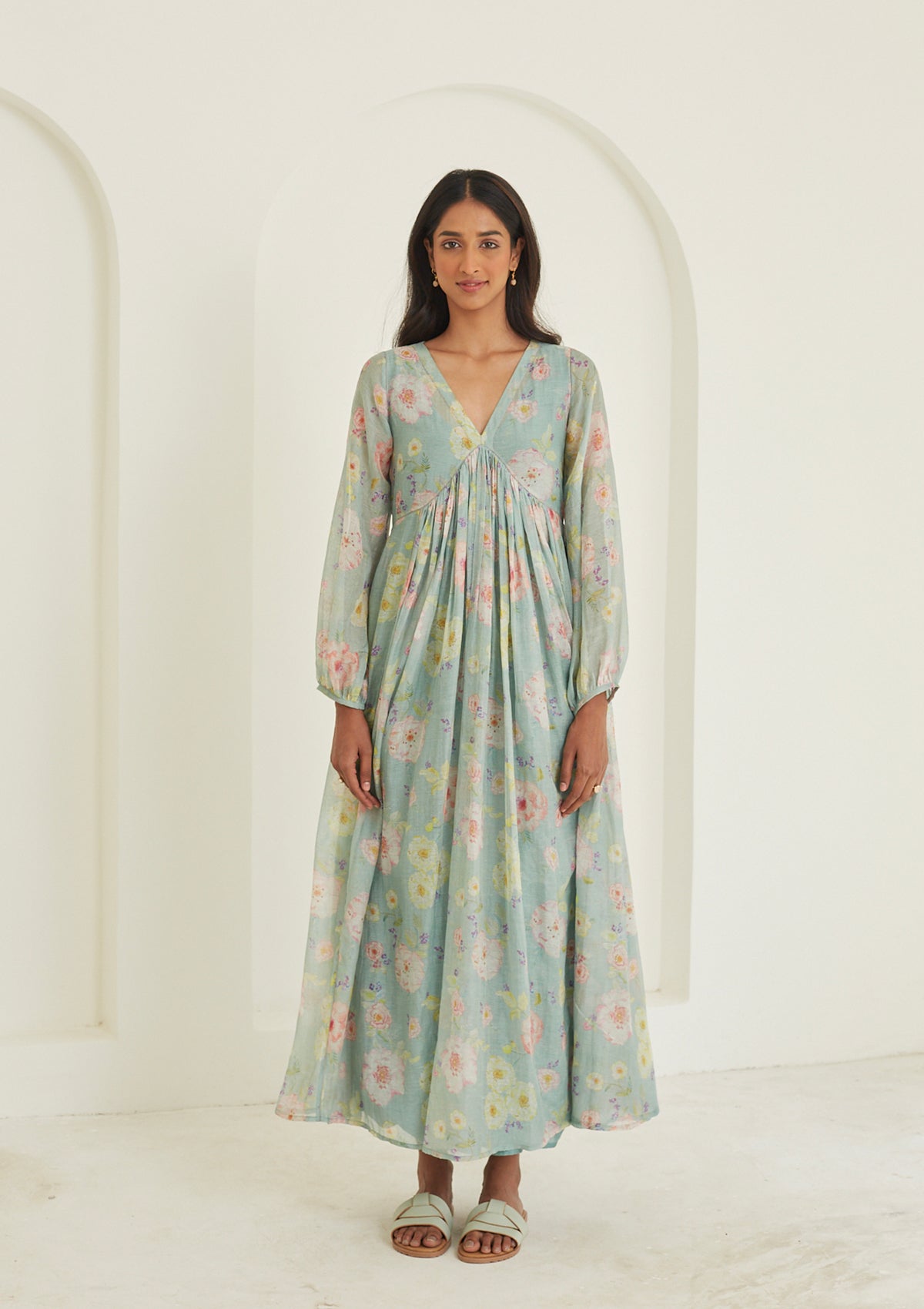 Handwoven maxi dress in sooti chanderi, from Surmaye. Sage green dress with hand-painted floral print, and a v-neck.