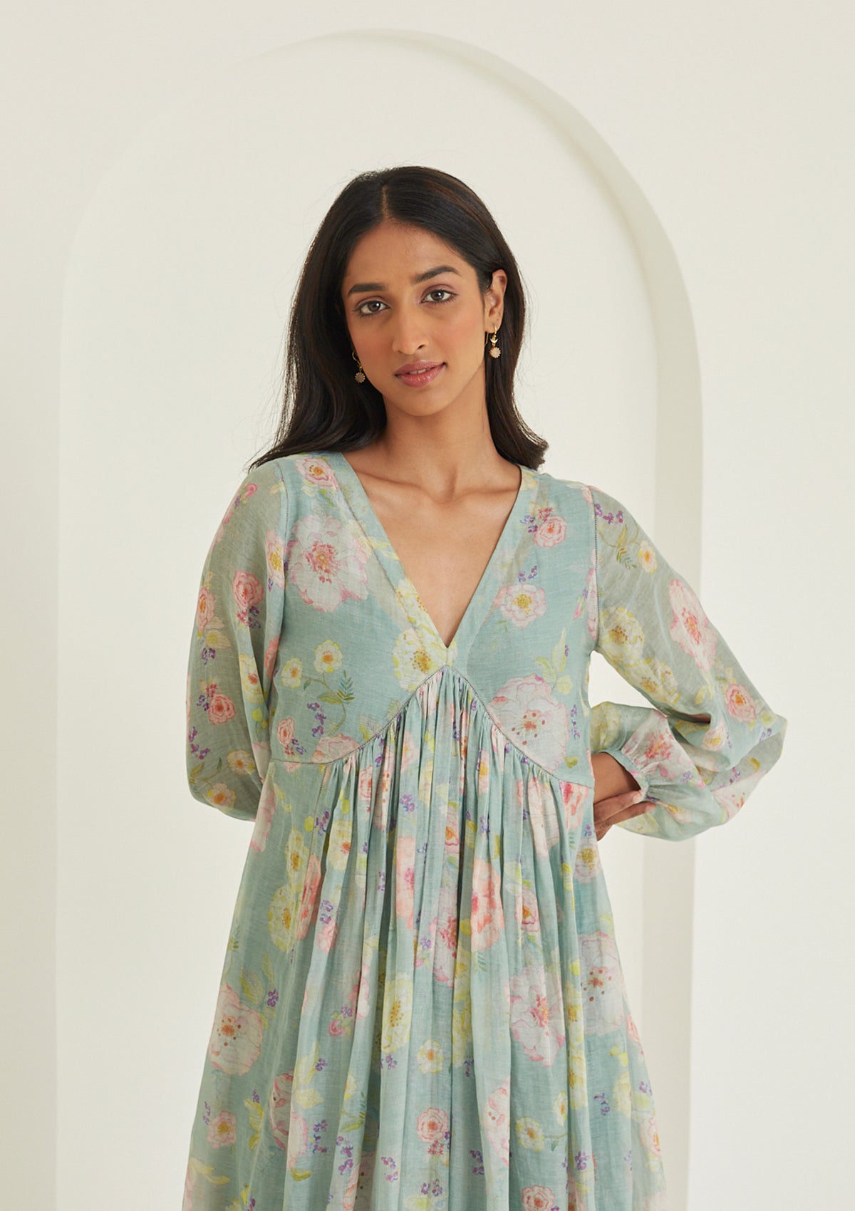 Handwoven maxi dress in sooti chanderi, from Surmaye. Sage green dress with hand-painted floral print, and a v-neck.