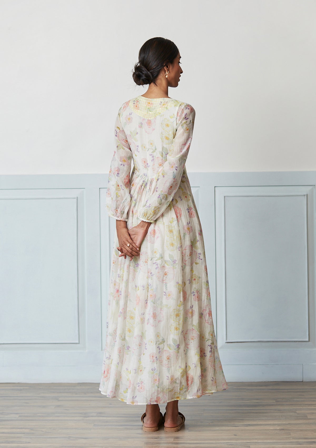 Handwoven maxi dress in sooti chanderi, from Surmaye. Ivory dress with a hand-painted floral print.