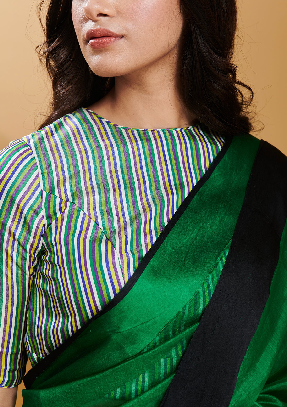 Green handloom saree in handwoven organza mulberry silk, from Surmaye. Dual-colour reversible border in green and black.