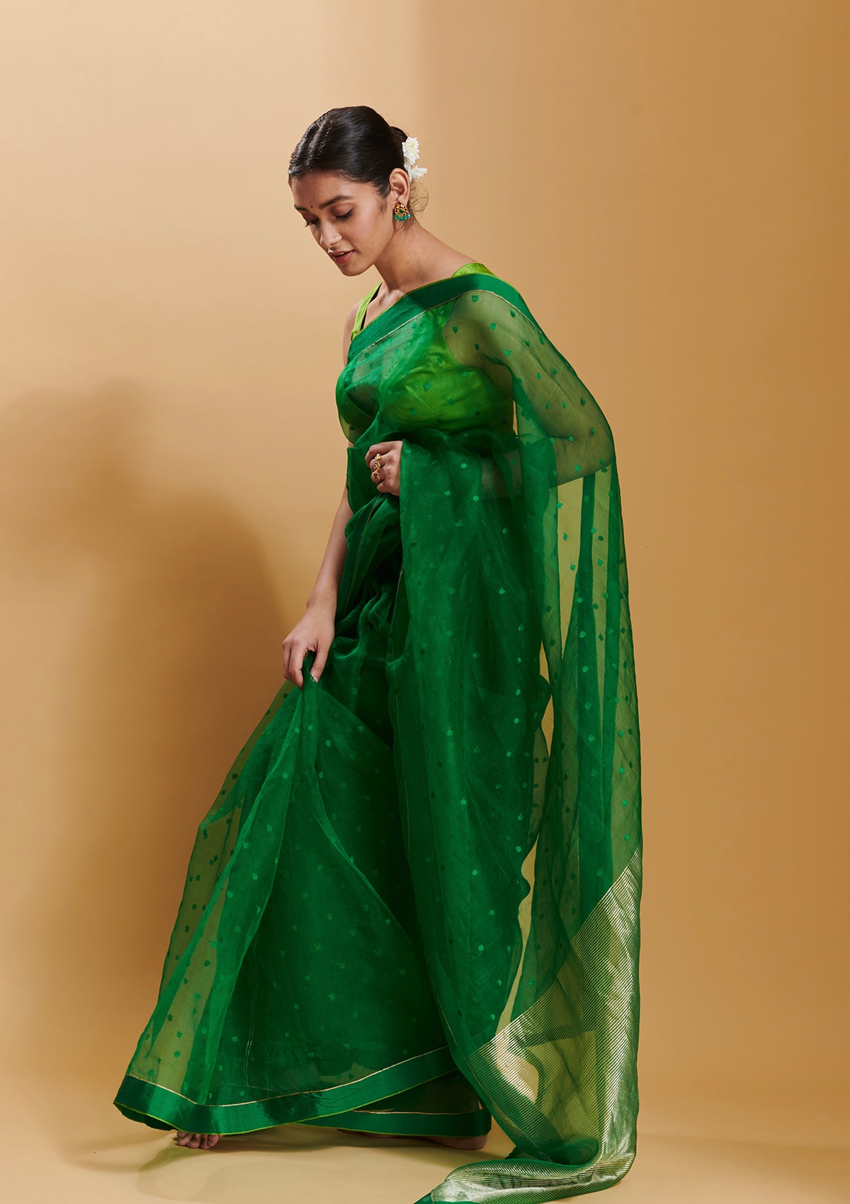 Green handloom silk organza jamdani saree, from Surmaye. Adorned with all-over jamdani weave dots.
