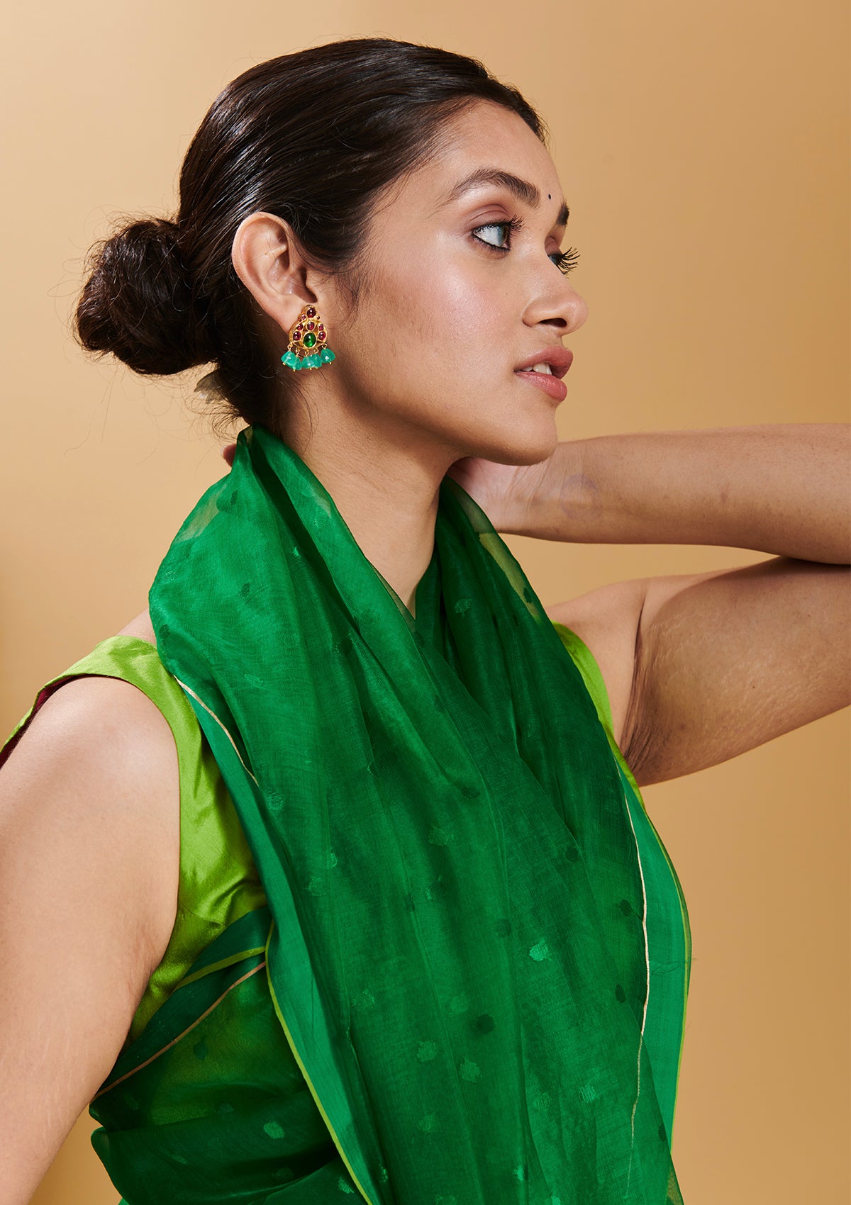 Green handloom silk organza jamdani saree, from Surmaye. Adorned with all-over jamdani weave dots.
