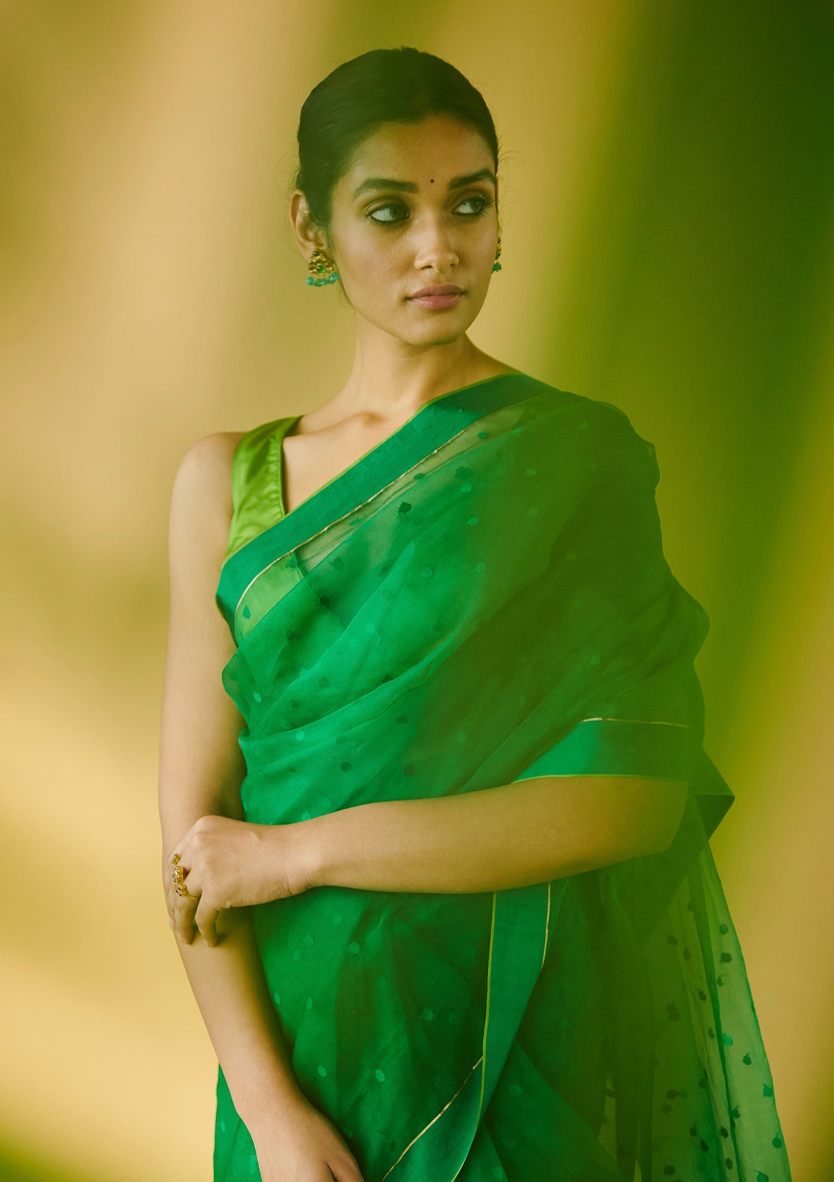 Green handloom silk organza jamdani saree, from Surmaye. Adorned with all-over jamdani weave dots.