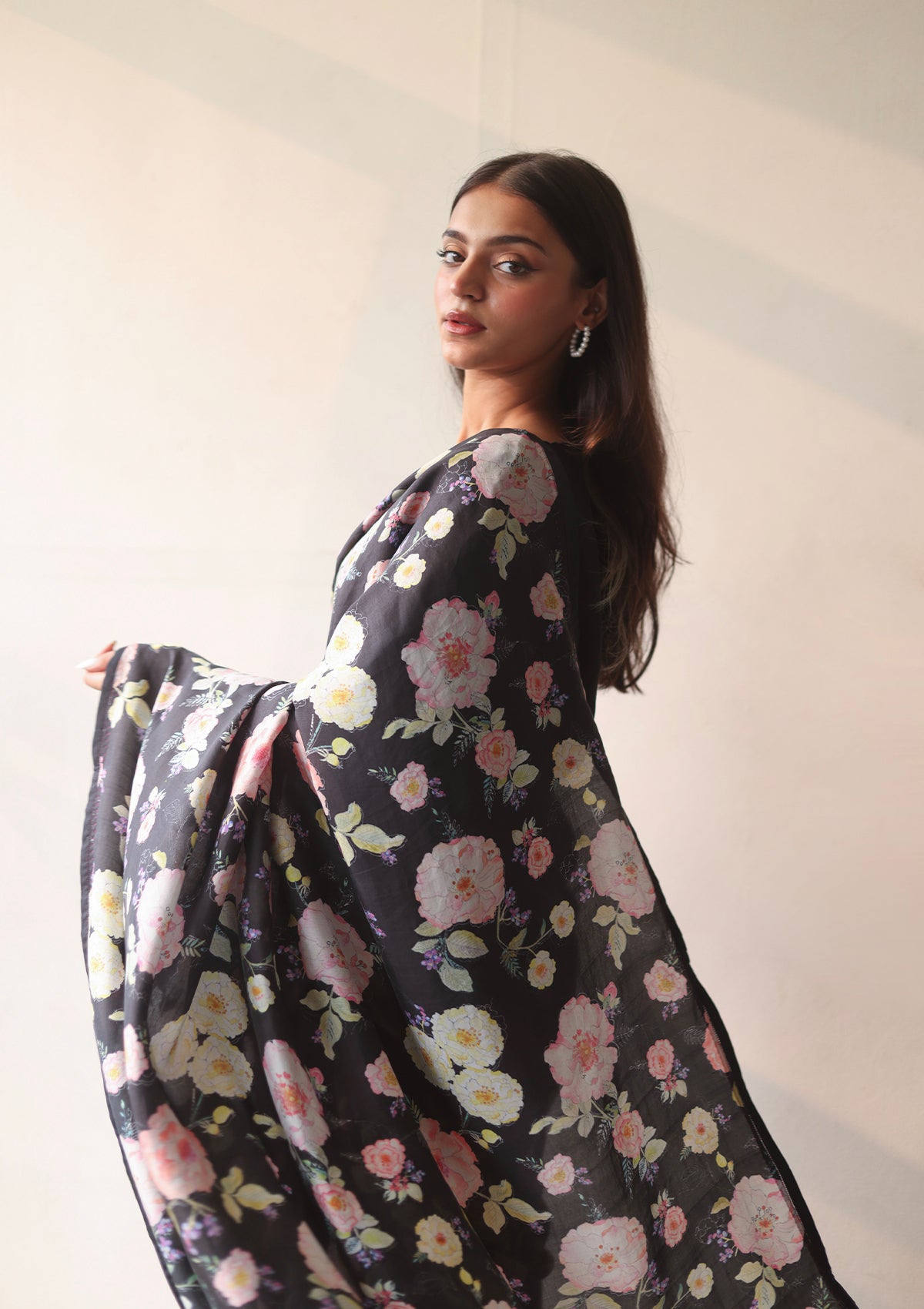 Handloom black saree from Surmaye, with hand-painted floral print on handwoven mulberry silk.