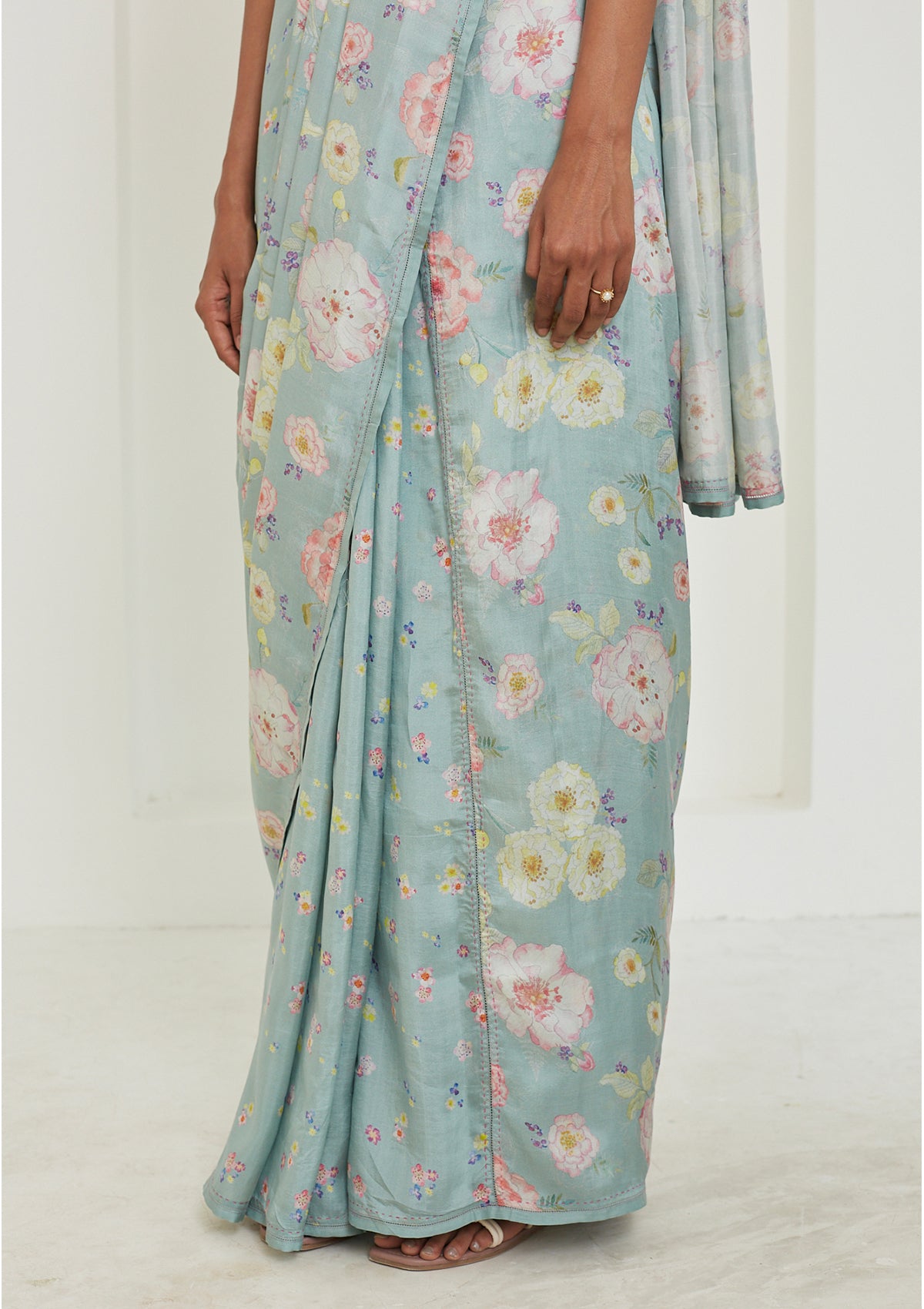 Handloom sage green saree from Surmaye. Hand-painted floral print on handwoven mulberry silk.