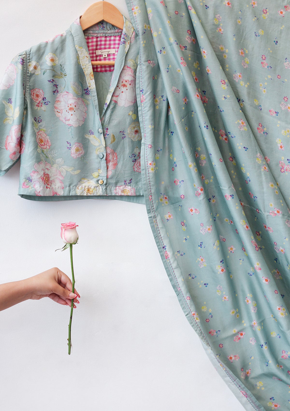 Handloom sage green saree from Surmaye. Hand-painted floral print on handwoven mulberry silk. Paired with sage green designer blouse in floral print.