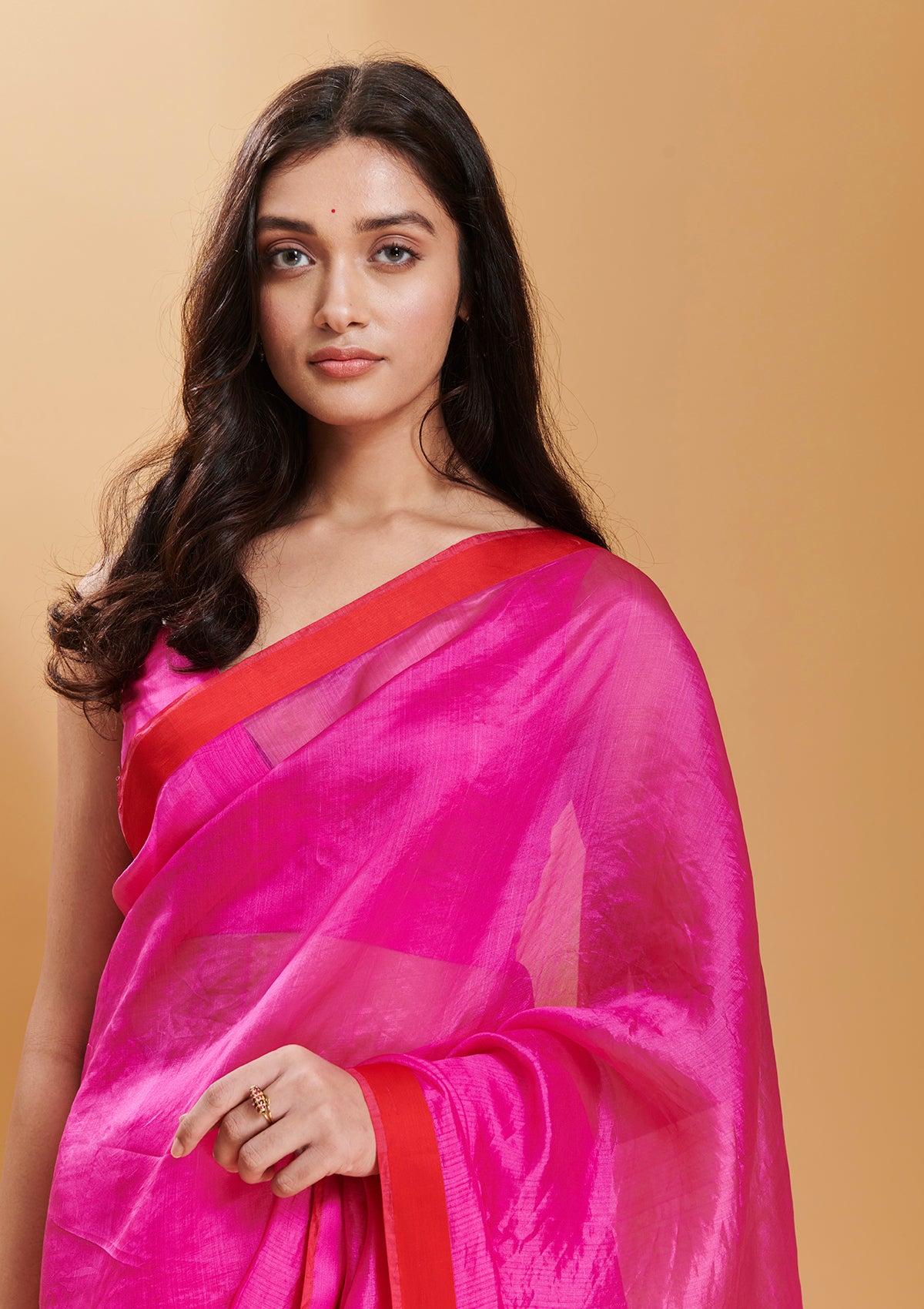 Pink handloom saree in handwoven organza mulberry silk, from Surmaye. Dual-colour reversible border in pink and red.
