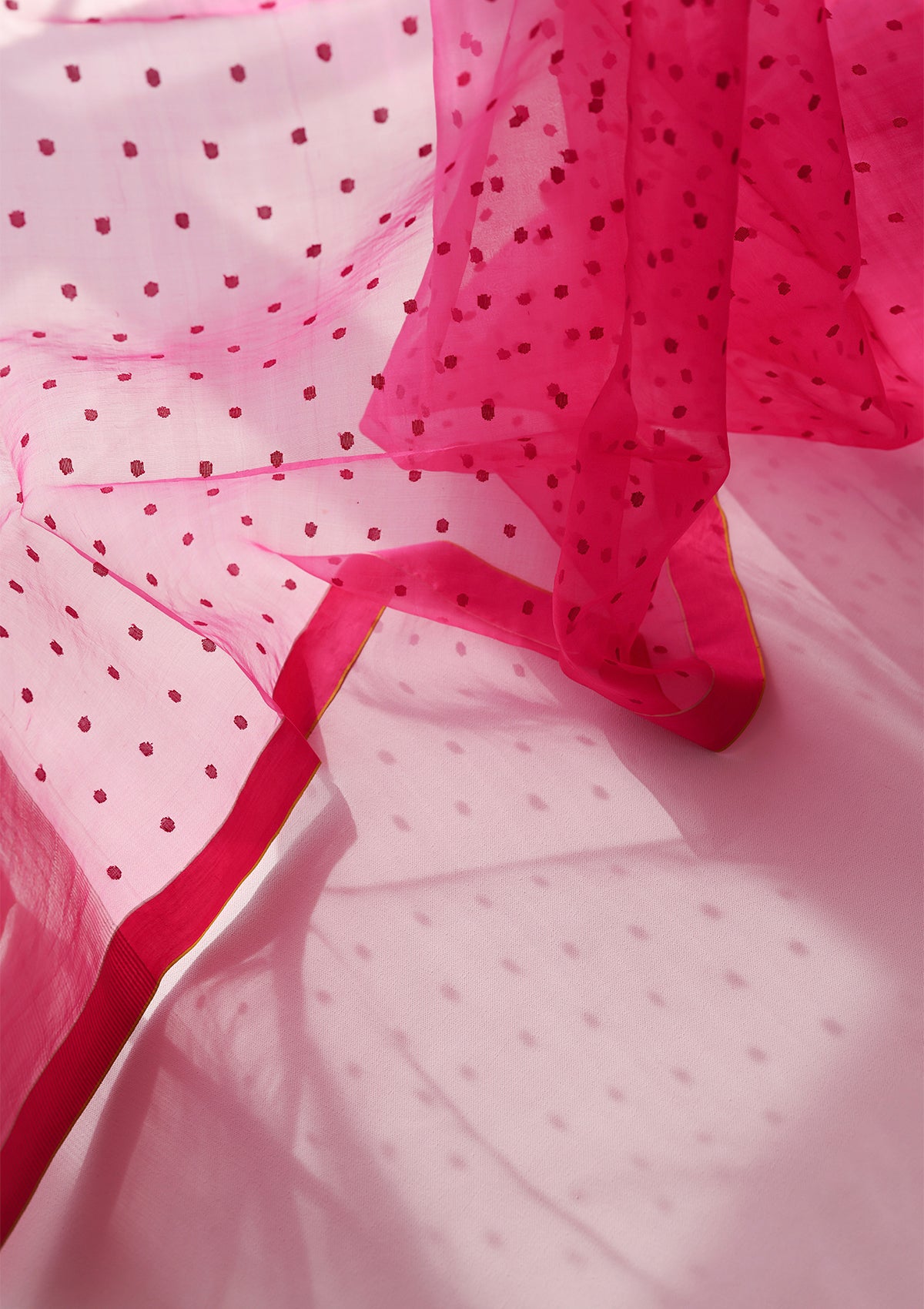 Pink handloom silk organza jamdani saree, from Surmaye. Adorned with all-over jamdani weave dots.