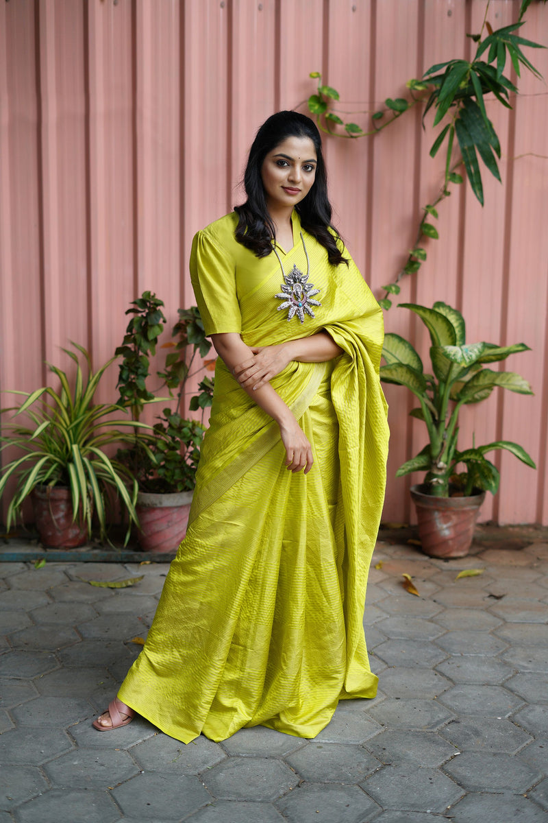 Nikhila Vimal in Yellow Silken Ripples Saree