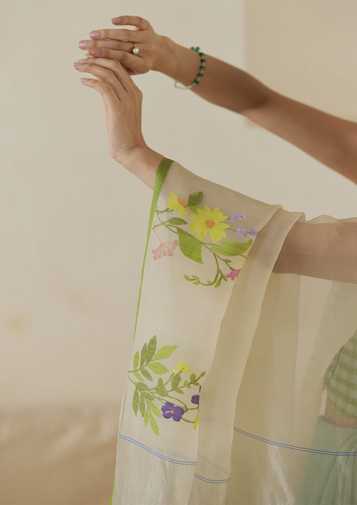 Handloom organza mulberry silk jamdani saree in seafoam and beige, from Surmaye. Close-up of intricate floral motifs