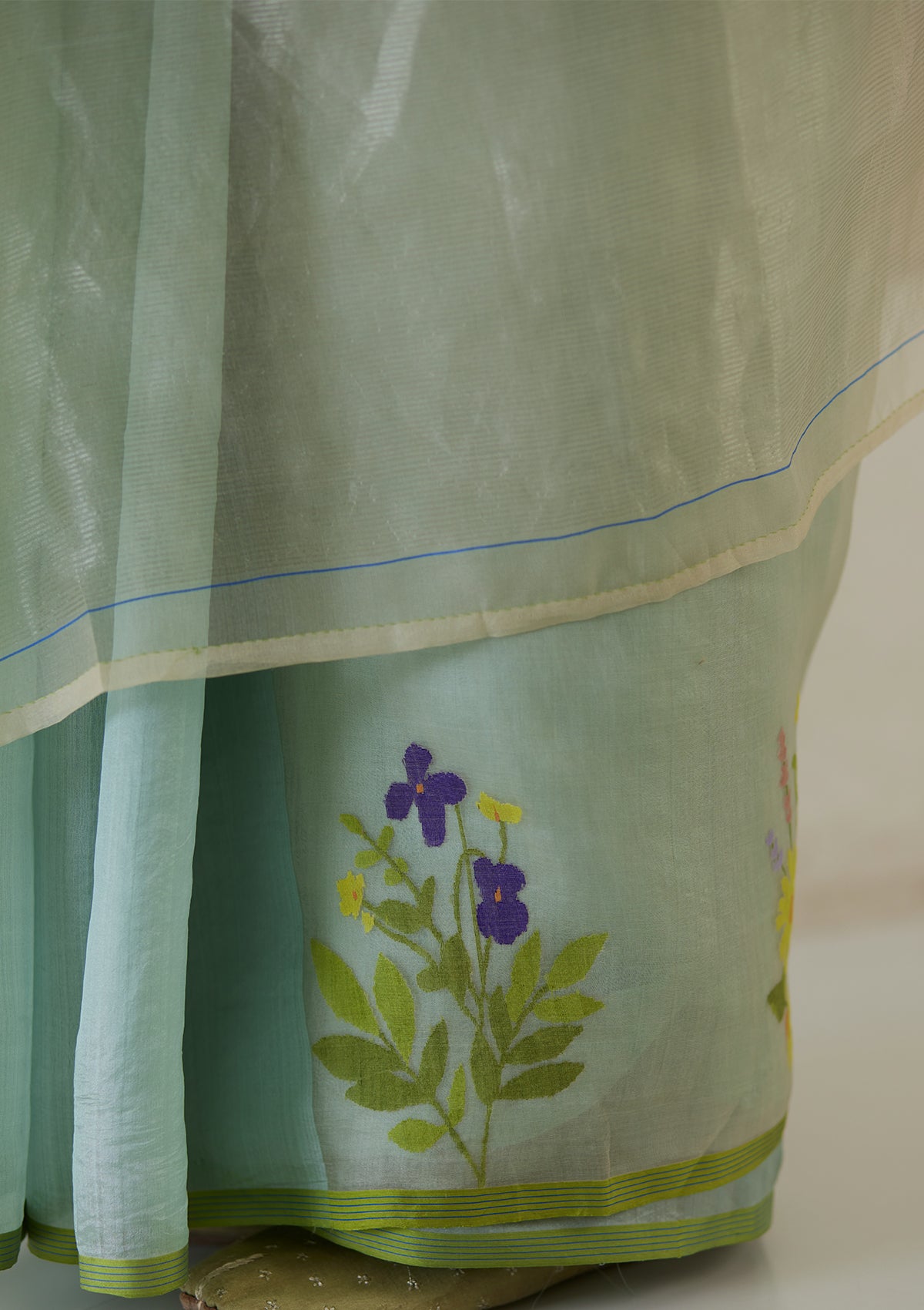 Handloom organza mulberry silk jamdani saree in seafoam and beige, from Surmaye. Close-up of intricate floral motifs