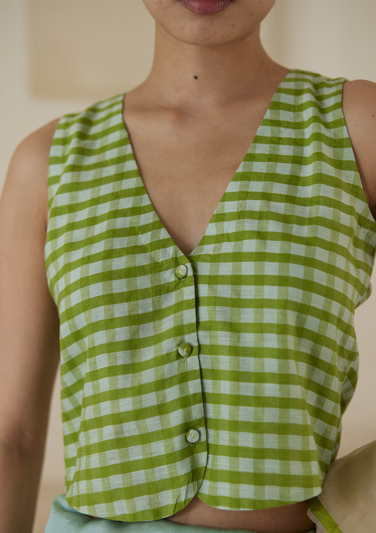 Handwoven designer green blouse in gingham checks, from Surmaye. 