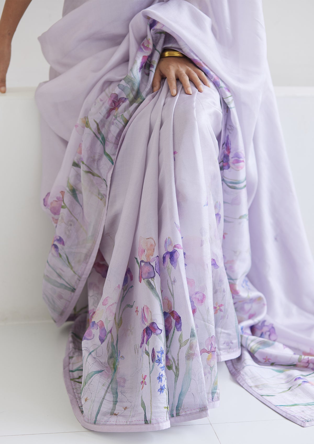 Handloom organza mulberry silk saree in mauve, from Surmaye. Intricate, hand-drawn, iris flower border print. 