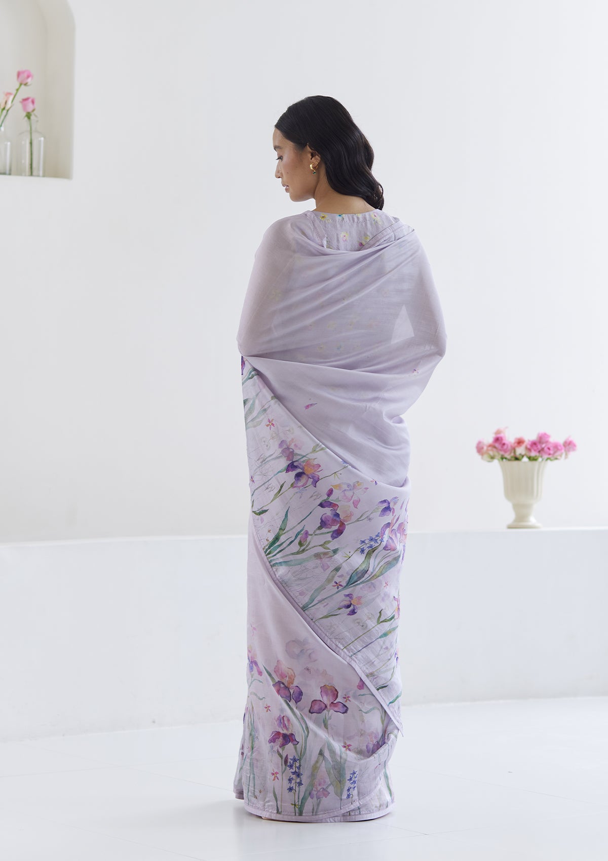 Handloom organza mulberry silk saree in mauve, from Surmaye. Intricate, hand-drawn, iris flower border print.