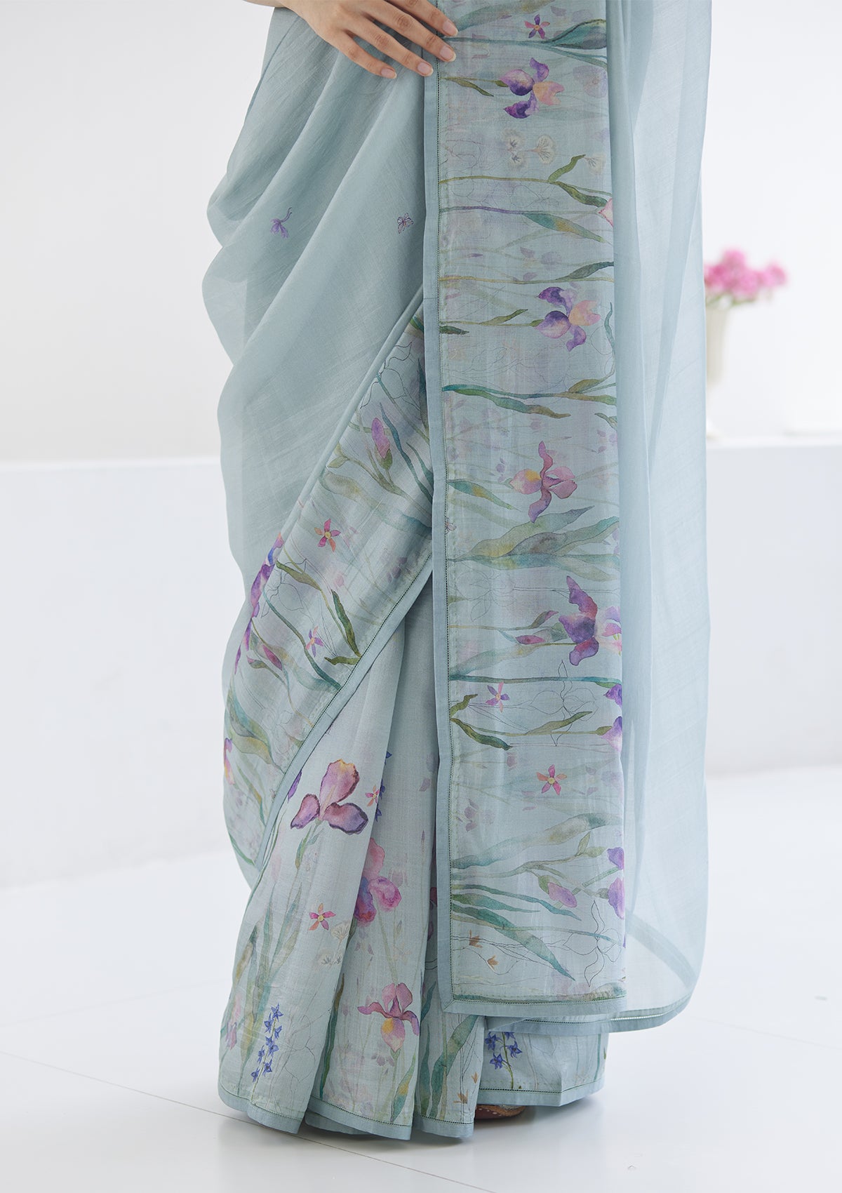 Handloom organza mulberry silk saree in seafoam, from Surmaye. Intricate, hand-drawn, iris flower border print. 