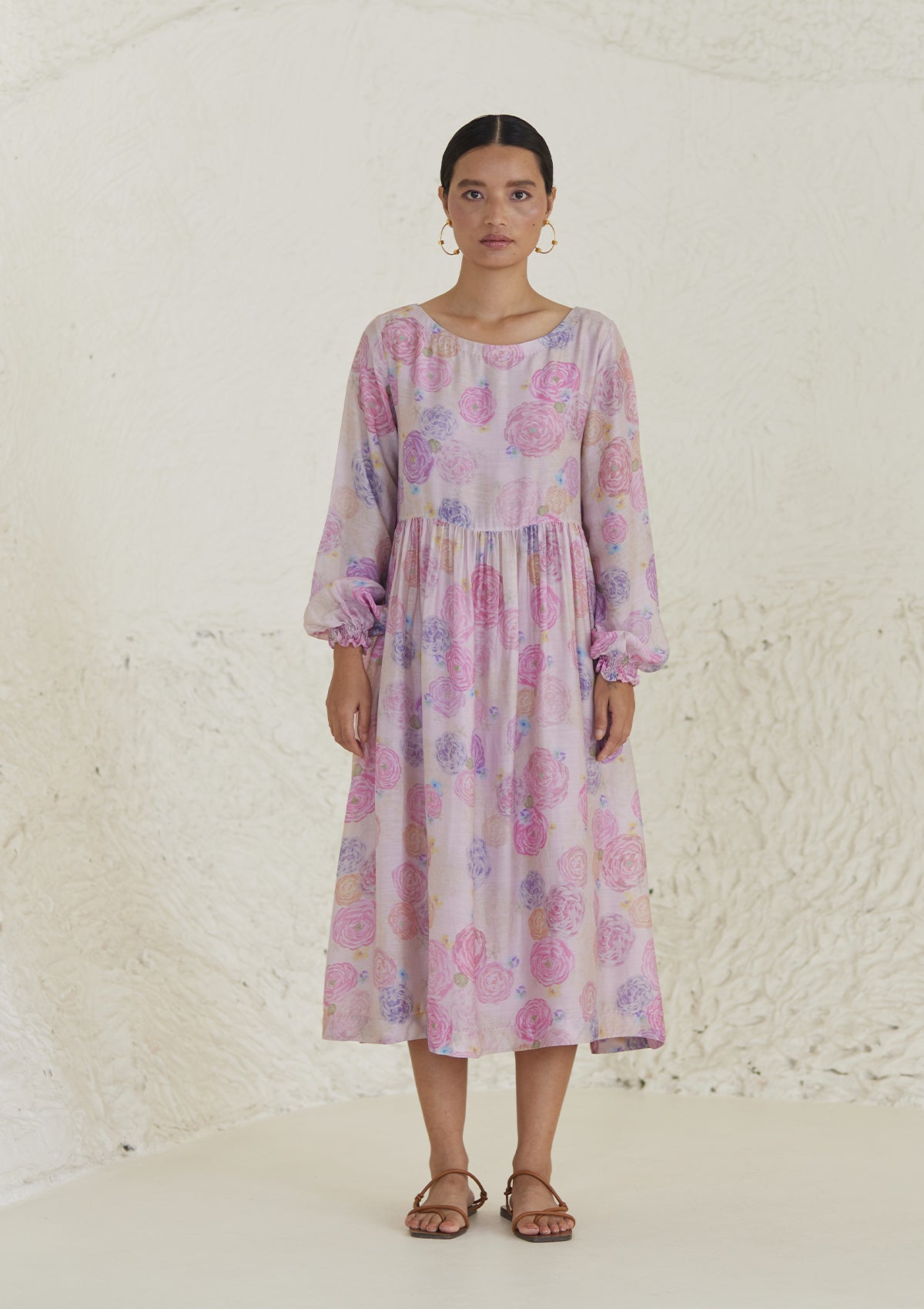 Floral pink dress in handwoven silk modal, from Surmaye. Ranunculus flower print, handmade in watercolour. Round neckline, and a full sleeve ruched at the hem.