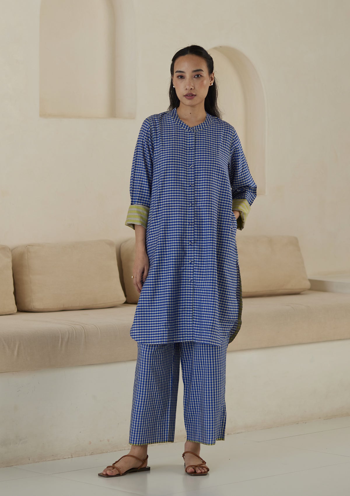 Kurta set for women, in blue checks, from Surmaye. Made in handwoven silk modal with a relaxed silhouette. Vibrant contrast-yellow striped fabric detailing.