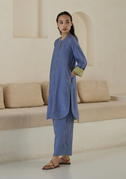 Kurta set for women, in blue checks, from Surmaye. Made in handwoven silk modal with a relaxed silhouette. Vibrant contrast-yellow striped fabric detailing.