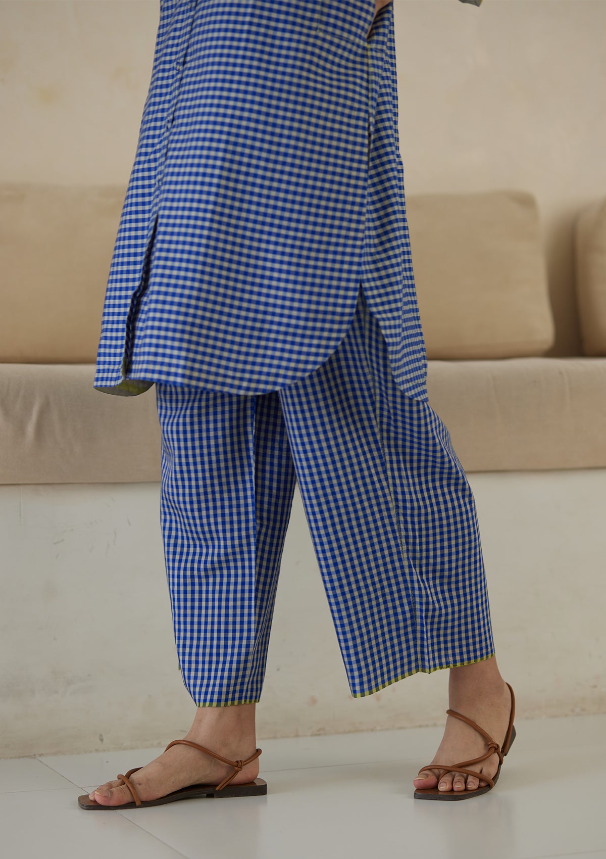 Kurta set for women, in blue checks, from Surmaye. Made in handwoven silk modal with a relaxed silhouette. Vibrant contrast-yellow striped fabric detailing.