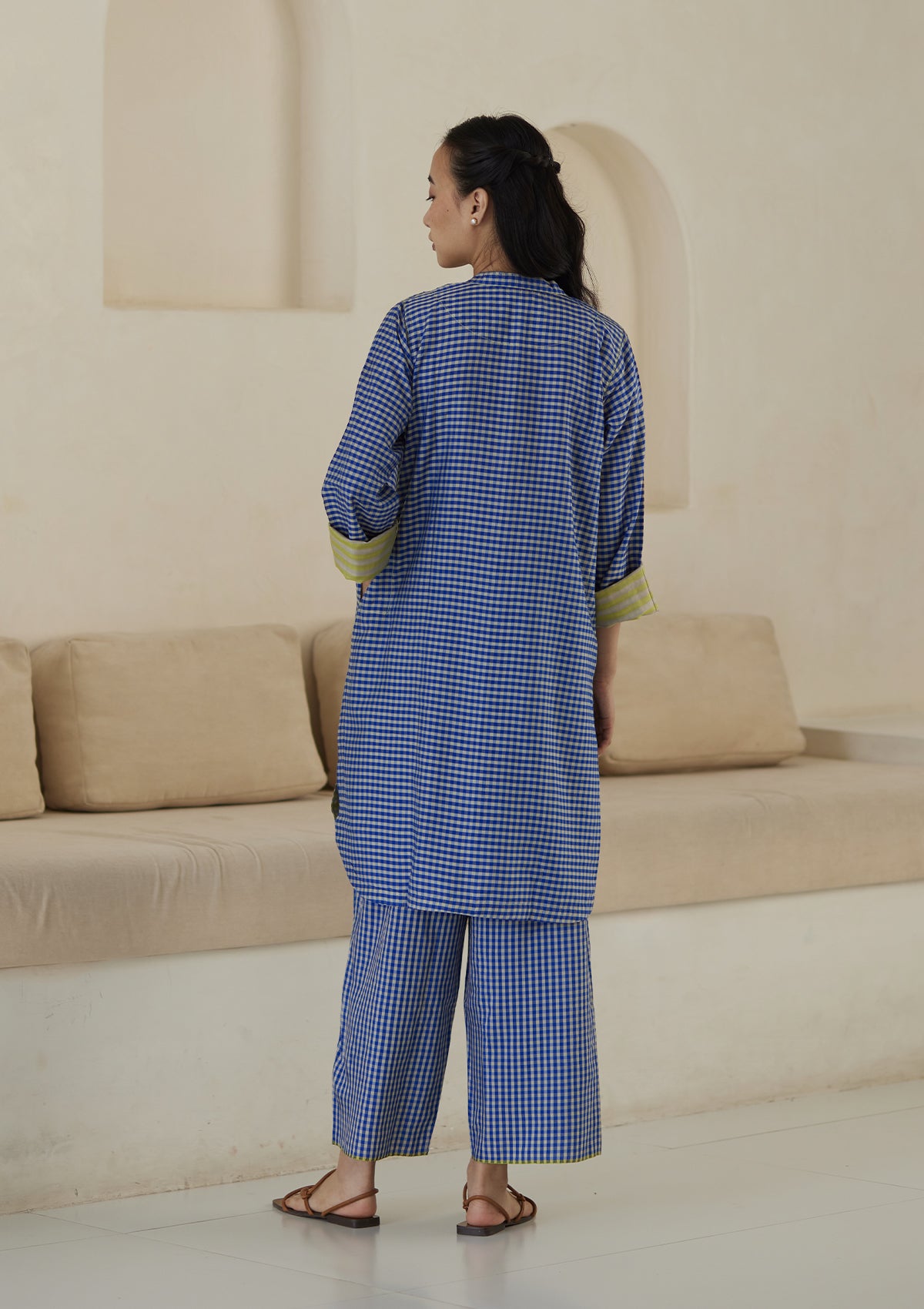 Kurta set for women, in blue checks, from Surmaye. Made in handwoven silk modal with a relaxed silhouette. Vibrant contrast-yellow striped fabric detailing.