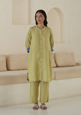 Kurta set for women, in lime stripes, from Surmaye. Made in handwoven silk modal with a relaxed silhouette. Vibrant contrast-blue checked fabric detailing.