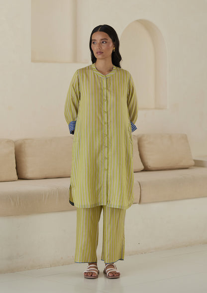 Kurta set for women, in lime stripes, from Surmaye. Made in handwoven silk modal with a relaxed silhouette. Vibrant contrast-blue checked fabric detailing.