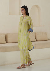 Kurta set for women, in lime stripes, from Surmaye. Made in handwoven silk modal with a relaxed silhouette. Vibrant contrast-blue checked fabric detailing.