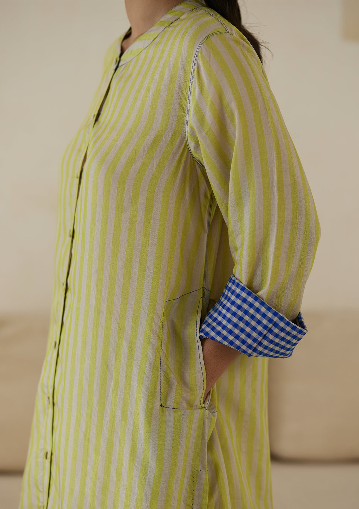 Kurta set for women, in lime stripes, from Surmaye. Made in handwoven silk modal with a relaxed silhouette. Vibrant contrast-blue checked fabric detailing.