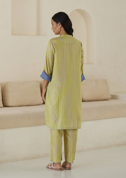 Kurta set for women, in lime stripes, from Surmaye. Made in handwoven silk modal with a relaxed silhouette. Vibrant contrast-blue checked fabric detailing.