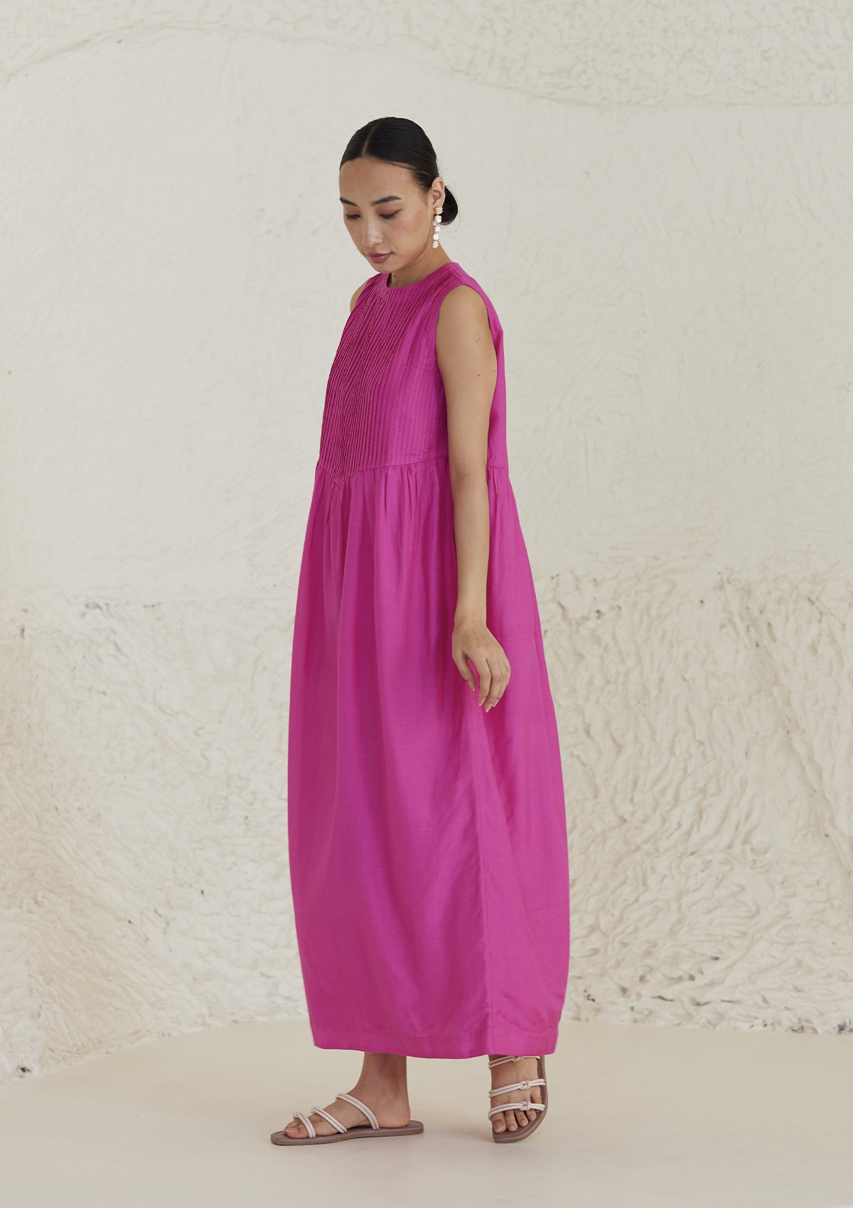 Pink silk dress from Surmaye, in handwoven silk modal. Exquisite pleat detailing on the front yoke. 