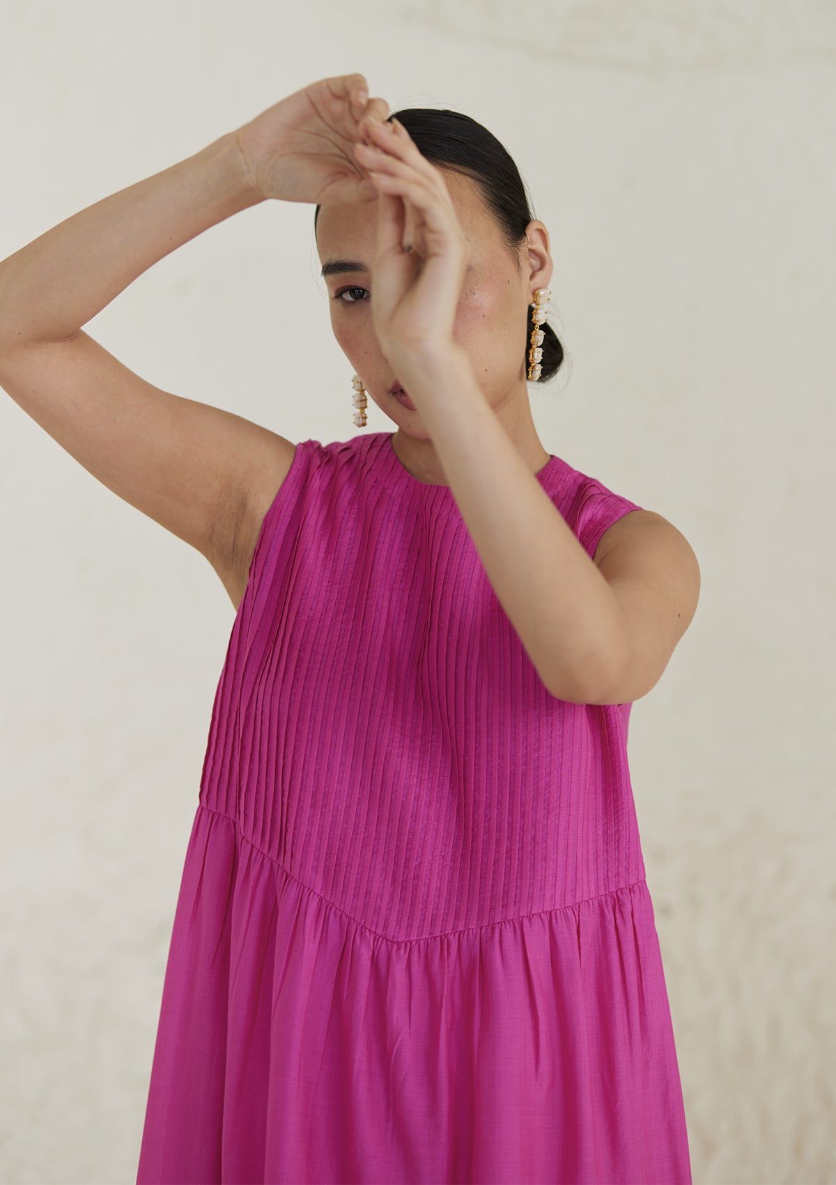 Pink silk dress from Surmaye, in handwoven silk modal. Exquisite pleat detailing on the front yoke.