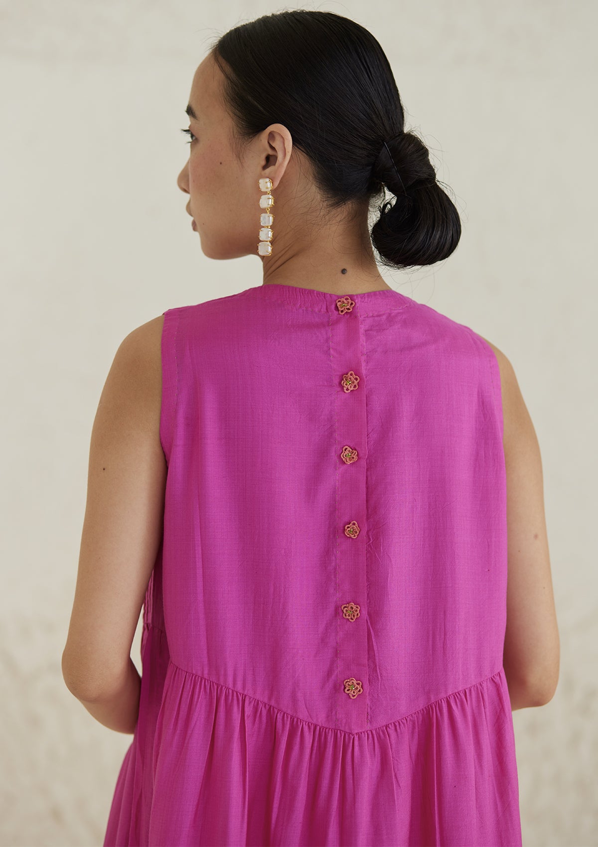 Pink silk dress from Surmaye, in handwoven silk modal. Handmade tatted flower buttons on the back yoke.