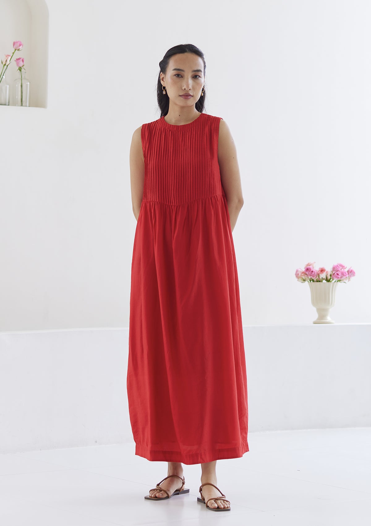 Red silk dress from Surmaye, in handwoven silk modal. Exquisite pleat detailing on the front yoke