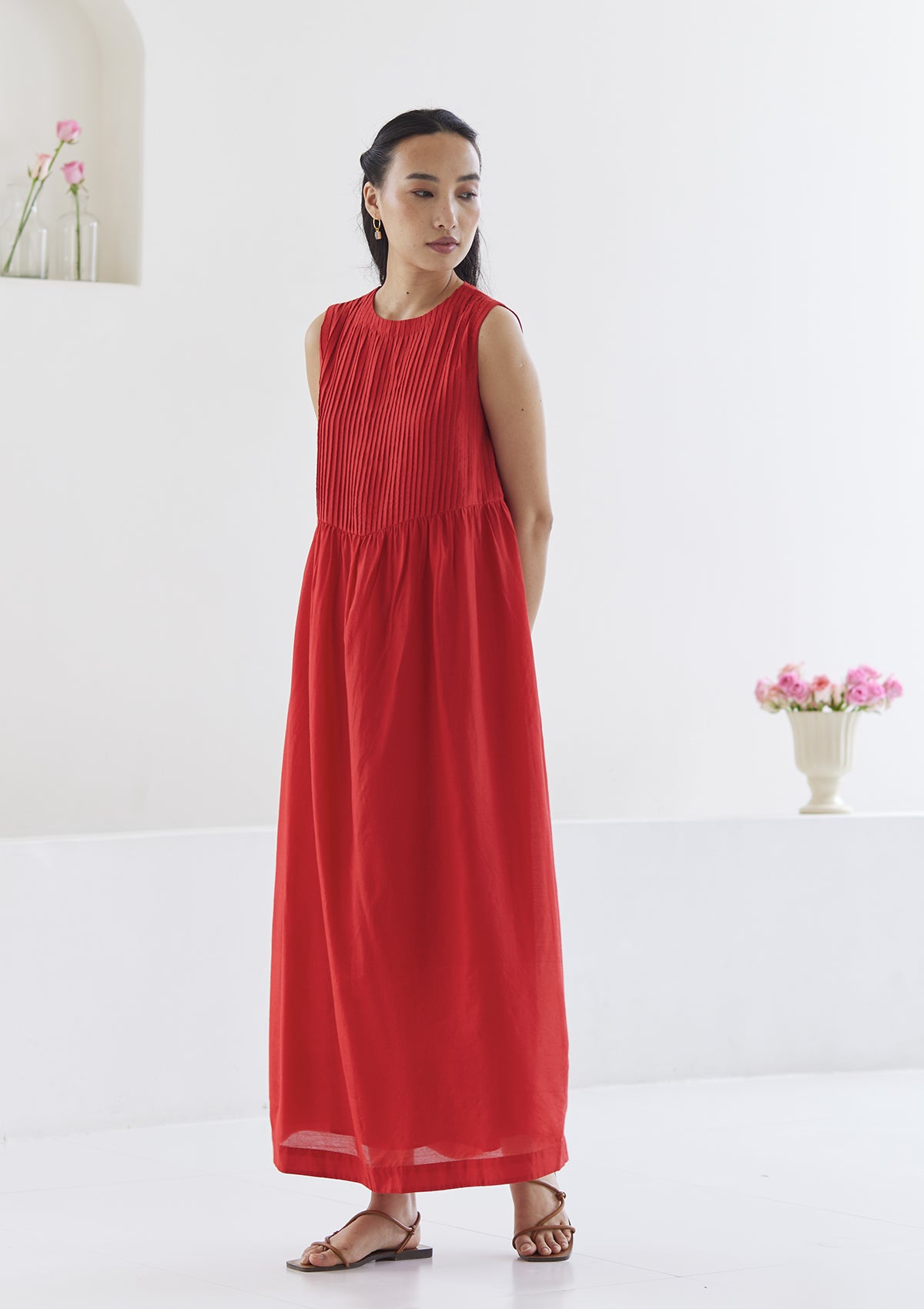 Red silk dress from Surmaye, in handwoven silk modal. Exquisite pleat detailing on the front yoke