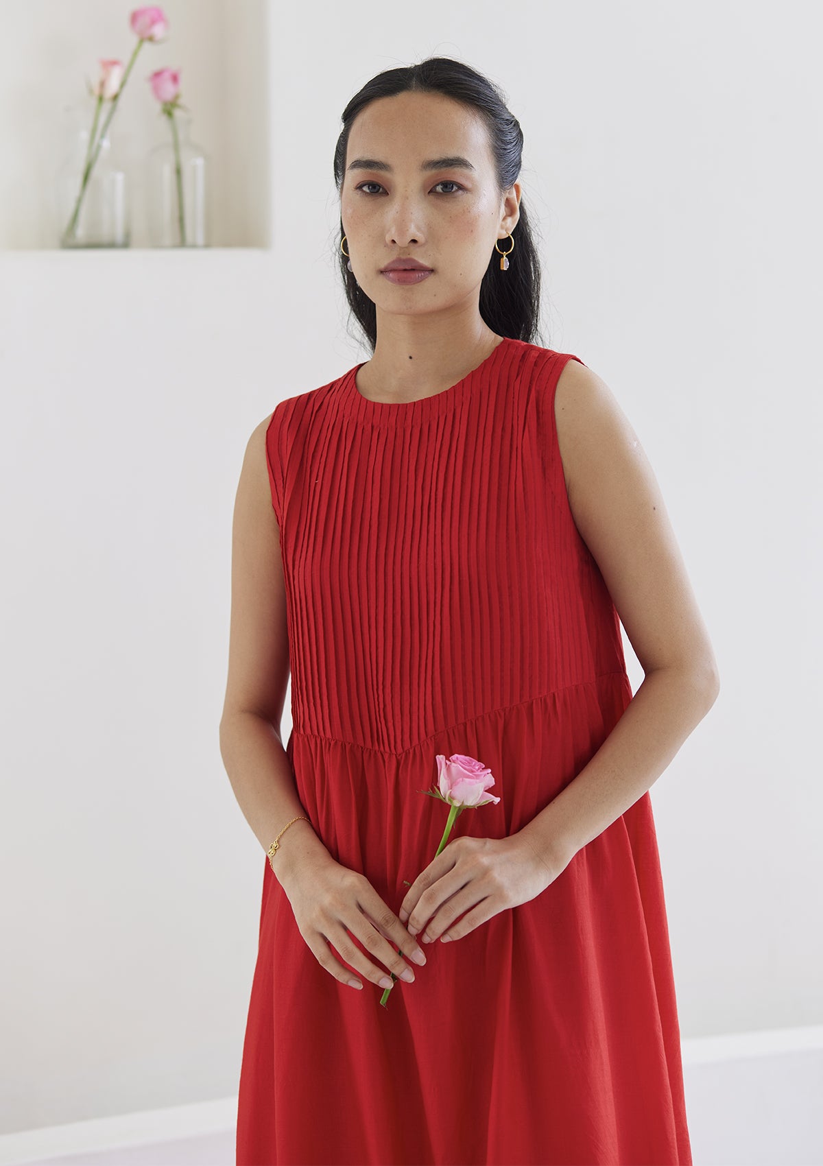 Red silk dress from Surmaye, in handwoven silk modal. Exquisite pleat detailing on the front yoke