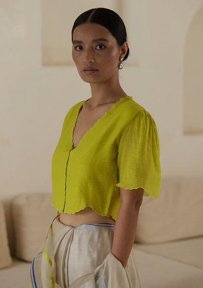 Lime designer blouse, crafted in handwoven silk khadi, from Surmaye. Scalloped embroidery edges all over. Lined with handwoven mulberry silk.