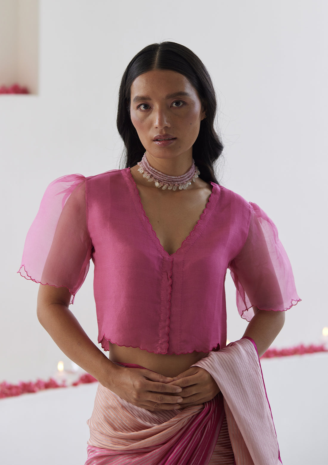 Pink designer blouse, crafted in handwoven organza silk, from Surmaye. Scalloped embroidery edges all over. Lined with handwoven mulberry silk.