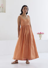 Handwoven maxi dress in silk modal, from Surmaye. Sleeveless dress in a fit-and-flare silhouette, with pink and orange stripes. Full view.