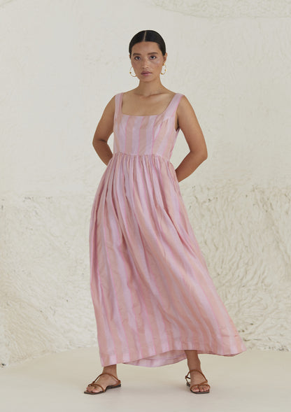 Handwoven maxi pink dress in silk modal, from Surmaye. Sleeveless dress in a fit-and-flare silhouette, with dual-toned pink stripes. 