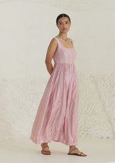 Handwoven maxi pink dress in silk modal, from Surmaye. Sleeveless dress in a fit-and-flare silhouette, with dual-toned pink stripes.