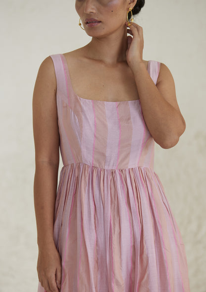 Handwoven maxi pink dress in silk modal, from Surmaye. Sleeveless dress in a fit-and-flare silhouette, with dual-toned pink stripes.