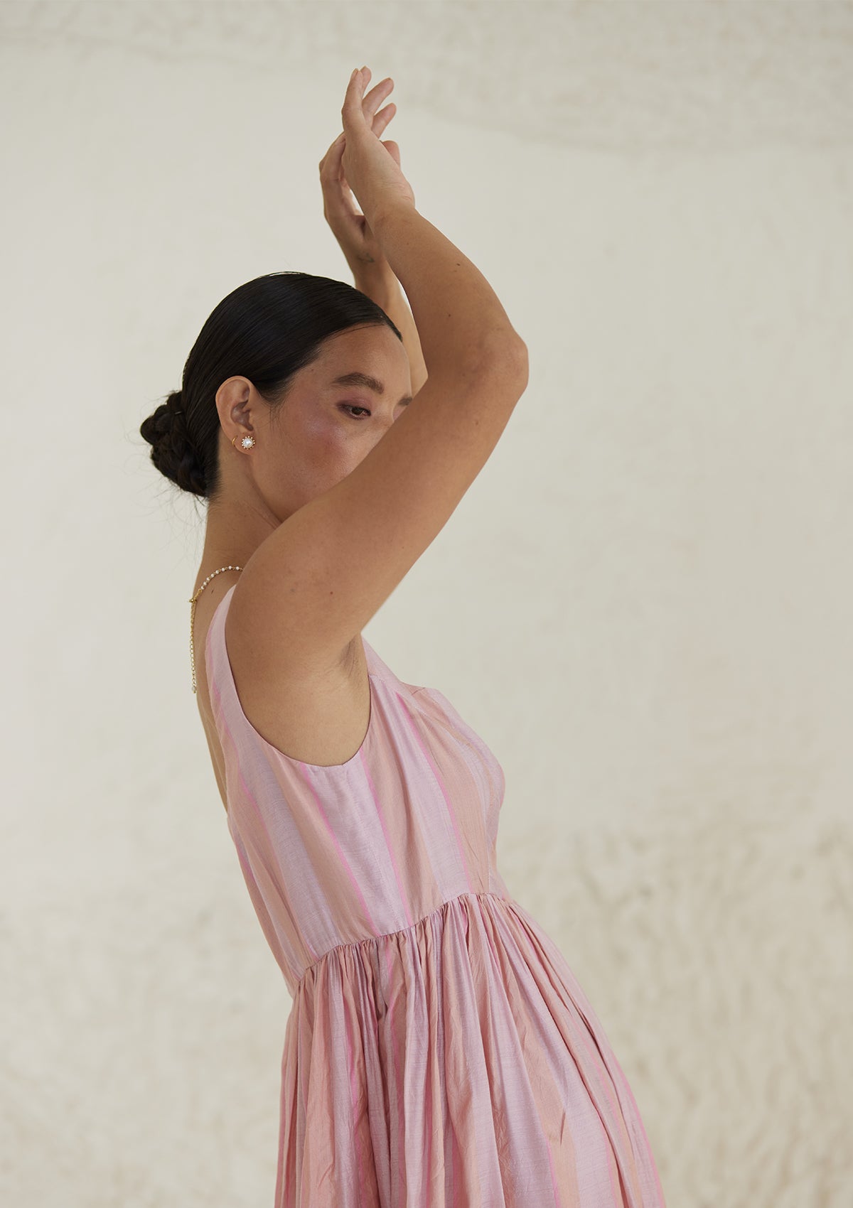 Handwoven maxi pink dress in silk modal, from Surmaye. Sleeveless dress in a fit-and-flare silhouette, with dual-toned pink stripes.